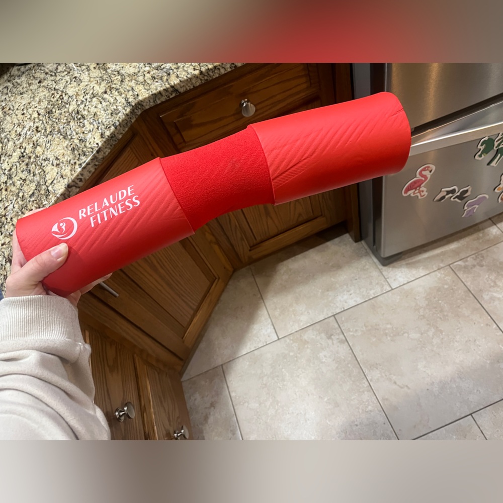 Red Relaude barbell pad with straps